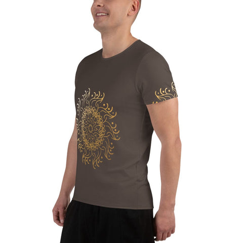 A smiling person wears a Magick "Guruuu" Men's Athletic T-shirt in dark green with an intricate yellow mandala design, blending style and performance against a plain white background.