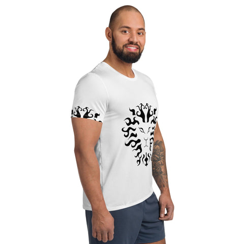 A gym-mad man with a beard and tattooed arm is smiling, wearing the Magick "Gym-mad" Men's Athletic T-shirt in white, featuring a captivating black tribal-style design on the chest and sleeves. Perfect for fitness enthusiasts, this tee incorporates moisture management technology. He completes his look with dark shorts.