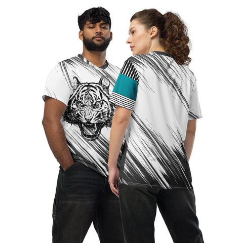 Two individuals stand side by side in matching magickwear "Tiger Inside" Unisex Sports Jerseys, featuring a bold tiger illustration on the front. The male on the left sports a beard and dark hair, while the female on the right has curly brown hair tied back and wears her shirt backward. Each jersey also boasts UPF50+ protection and is made from recycled polyester fabric.