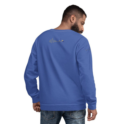 A man with short dark hair and a beard is wearing the stylish and comfortable "Breathe" Unisex Lettering Sweatshirt from magickwear. The blue long-sleeve shirt features a graphic design on both the back and left sleeve. He is facing slightly away from the camera, showcasing the back of the shirt and part of its unique design. He is also wearing jeans.