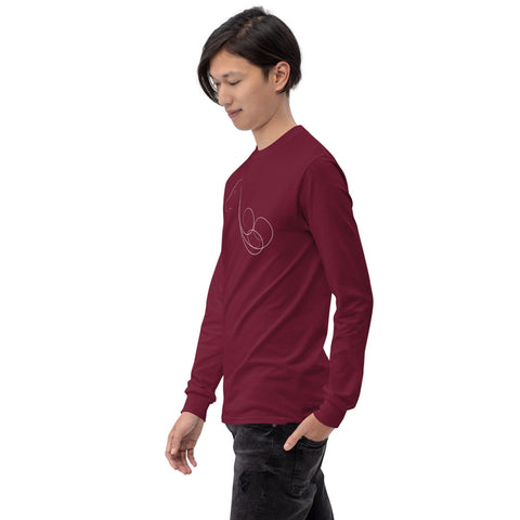 A person with long dark hair wearing a maroon "Animal Force" Men’s Long Sleeve Shirt from magickwear, featuring a minimalist line art design on the chest, stands against a plain background. The 100% cotton shirt complements their black pants as they look down and to the side, one hand casually in their pocket.