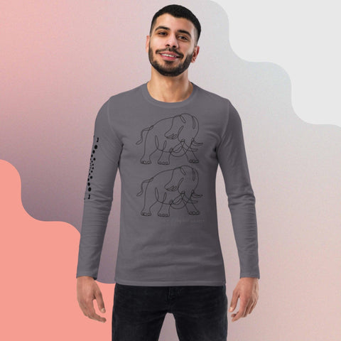 A man with short dark hair and a beard smiles while wearing magickwear's eco-friendly "Carry On" Unisex fashion long sleeve shirt in gray. The shirt features a minimalist black line drawing of two elephants on the front and a pattern of small dots on the right sleeve. The versatile background has a gradient of gray to pink wavy shapes.