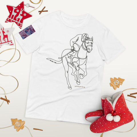 The "Keep Going" Short-Sleeve T-Shirt by magickwear showcases a line drawing of a jockey on a horse, complemented by festive red and white ornaments. Crafted from 100% ring-spun cotton, this comfy and chic tee pairs seamlessly with red slippers embellished with white pompoms.