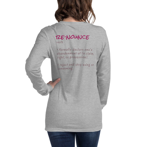 A person with wavy brown hair, dressed in a grey, long-sleeve magickwear "Renounce" Ladies' Tee, is turned away from the camera. The shirt features the definition of the word "RENOUNCE" printed on the back in pink and brown text.