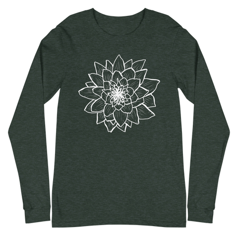 The "Thrive" Unisex Long Sleeve Tee by magickwear is a dark green long sleeve shirt featuring a white outline drawing of a large dahlia flower prominently displayed in the center on the front. Made from 100% combed and ring-spun cotton, this versatile wardrobe addition is laid flat against a solid teal background.