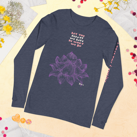 The "Beauty We Love" Unisex Long Sleeve Lettering Tee from magickwear is a dark gray shirt adorned with a large purple flower design and the inspiring quote "LET THE BEAUTY WE LOVE BE WHAT WE DO" above it. The sleeve features additional pink text, making this versatile tee perfect for any occasion. Displayed laid flat with yellow flowers and lollipops around it, this unique piece is both stylish and meaningful.