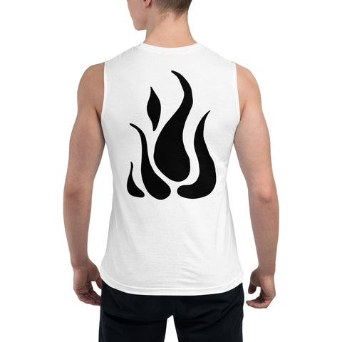 Sporting a "Dauntless" Muscle Shirt from magickwear, made of airlume combed ring-spun cotton and showcasing a bold black abstract flame on the back. The sleeveless tank accentuates their short hair and pairs perfectly with black pants.