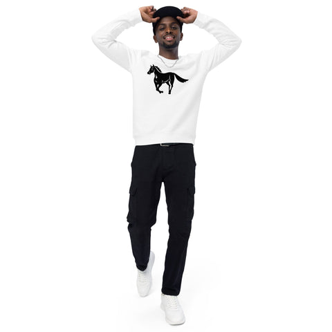 A person wearing magickwear's "A Horse's Kingdom" 100% organic cotton white Unisex Organic Raglan Sweatshirt with a black horse graphic, black cargo pants, and white sneakers stands against a plain white background. They have their hands on their black cap, appearing relaxed and smiling.