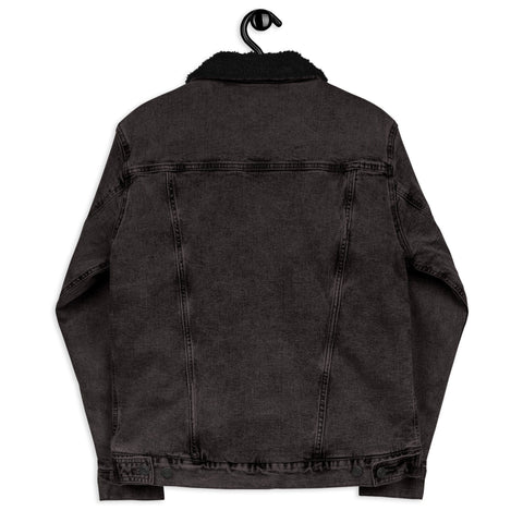 Back view of the "Snug Warm!" Unisex Denim Sherpa Jacket by magickwear, featuring a dark fur collar and hanging on a black hanger. This classic jacket boasts a relaxed fit with detailed stitching along the seams and adjustable waist tabs for an eco-friendly style.